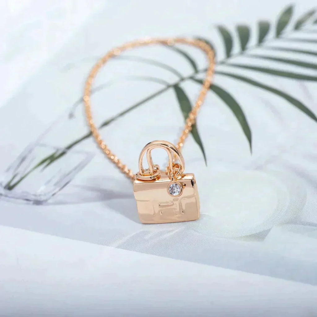 HERMES AMULETTE PEDANT ROSE GOLD NECKLACE