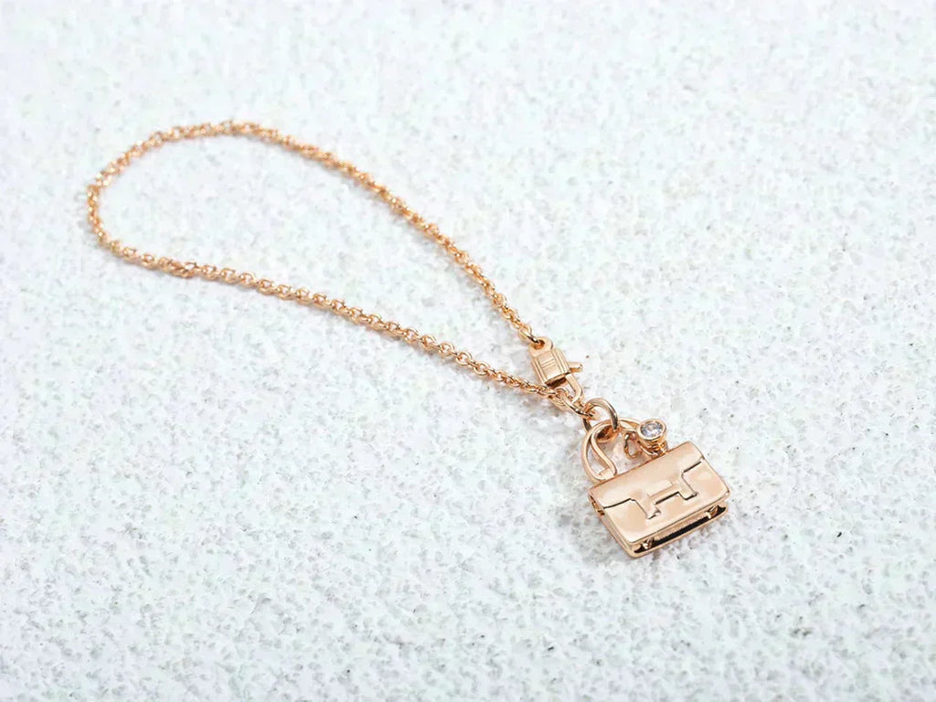 HERMES AMULETTE PEDANT ROSE GOLD NECKLACE